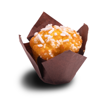 Golden muffin topped with white sugar pearls, wrapped in a brown tulip baking cup on a white background.