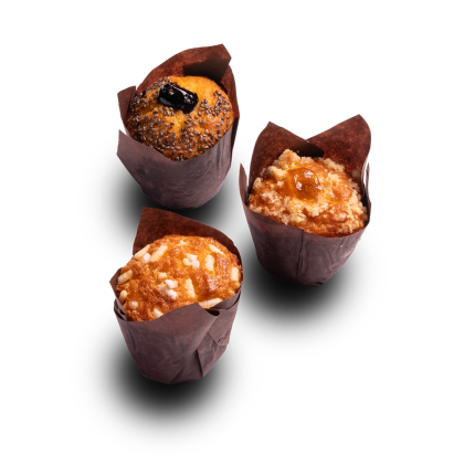 Three muffins in brown tulip wrappers: poppy seed with berry, crumb-topped with jam, and almond-topped, on white back...