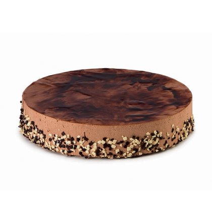 Round chocolate mousse cake with a marbled ganache top and edges coated in chocolate crumb and nut pieces.