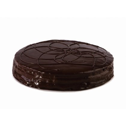 Round chocolate glazed cake with decorative swirl pattern on top, set against a white background.