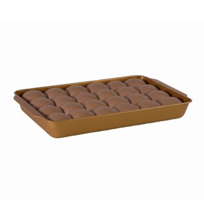 Gold rectangular baking pan filled with rows of round bread rolls, on a white background.