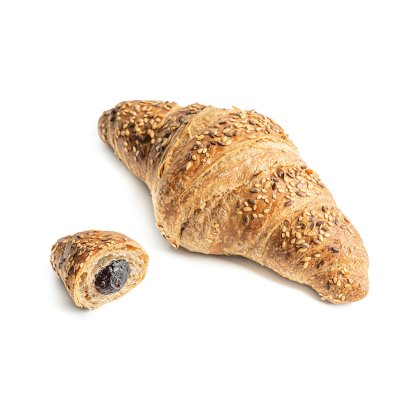 Whole grain croissant topped with sesame seeds, with a smaller piece cut open revealing dark berry filling.