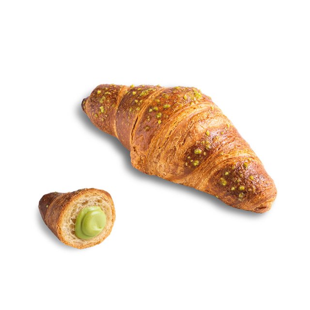 Golden croissant topped with pistachio crumbs, with a smaller piece cut open to reveal green pistachio cream filling.