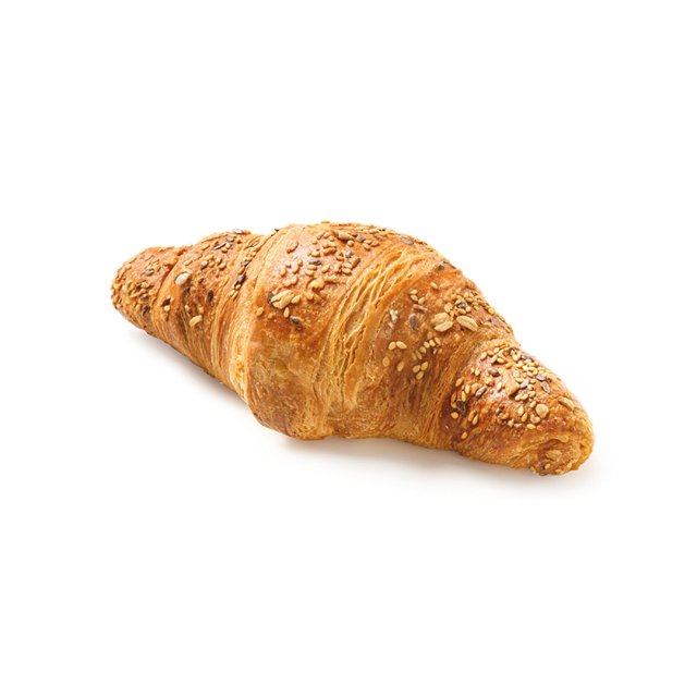Golden-baked multigrain croissant topped with seeds and oats, shown on a plain white background.