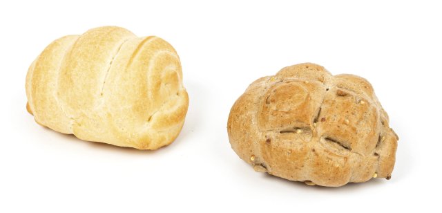Two bread rolls side by side on a white background, one plain white roll and one multigrain seeded roll.