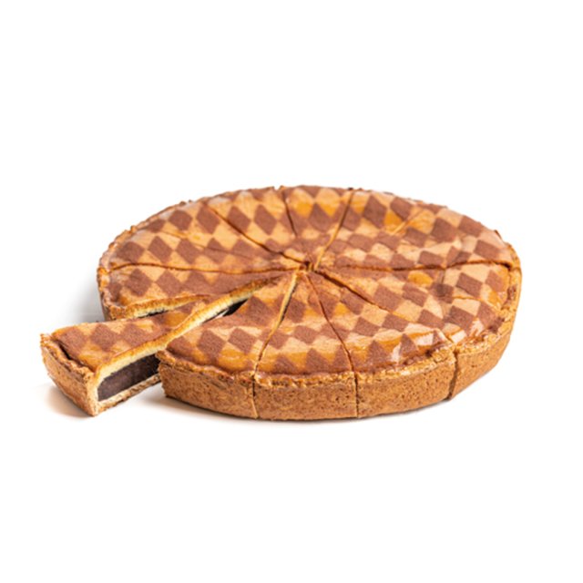 Round tart with a checkered brown and tan pattern on top, pre-cut into slices, with one slice pulled out showing dark...