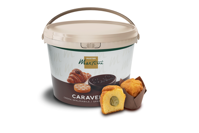 Large tub of Master Martini Caravel spreadable cream beside a sliced muffin filled with the cream and a whole muffin.