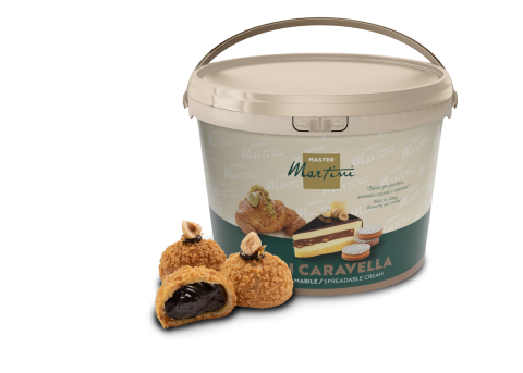 Bucket of Master Martini spreadable cream with chocolate-filled pastries and a layered cake shown beside it.