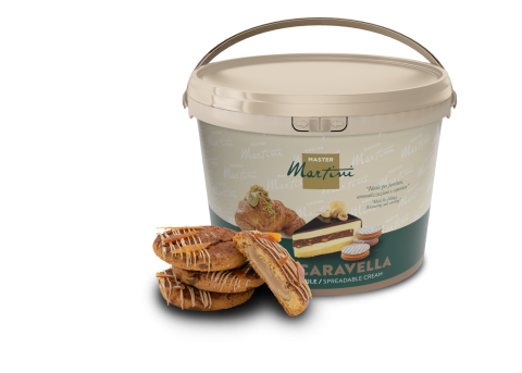 A large plastic tub of Master Martini Caravella spreadable cream beside filled pastries drizzled with white chocolate.