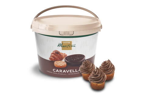 Bucket of Master Martini Caravella spreadable cream beside three cupcakes topped with chocolate frosting swirls.