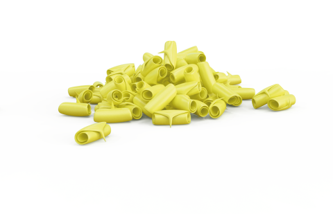 A pile of curled, yellow tubular pasta shapes resembling rigatoni scattered on a white background.